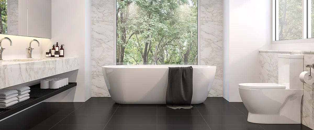 Elegant bathroom with black tiles flooring and tub