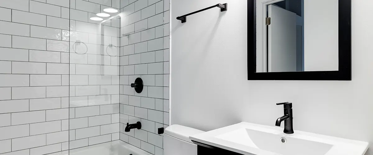 Black fixtures and while tiling for shower
