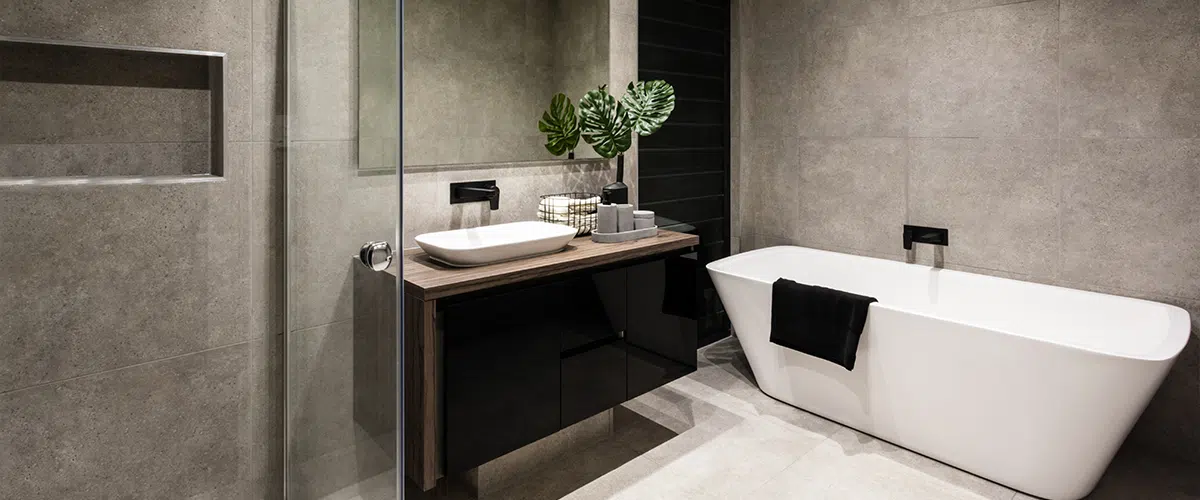 Elegant bath with white tub and dark towel