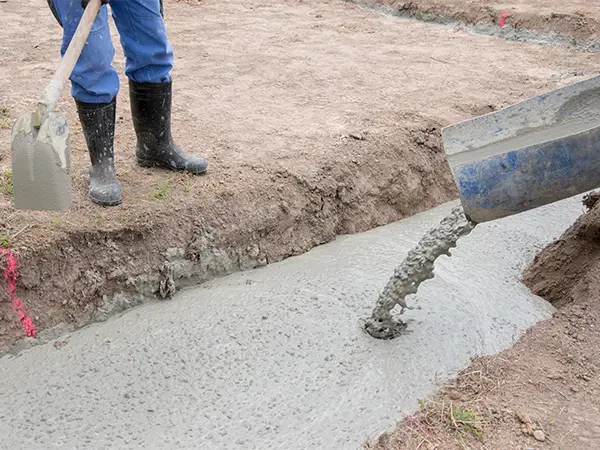 Pouring concrete for basement foundation
