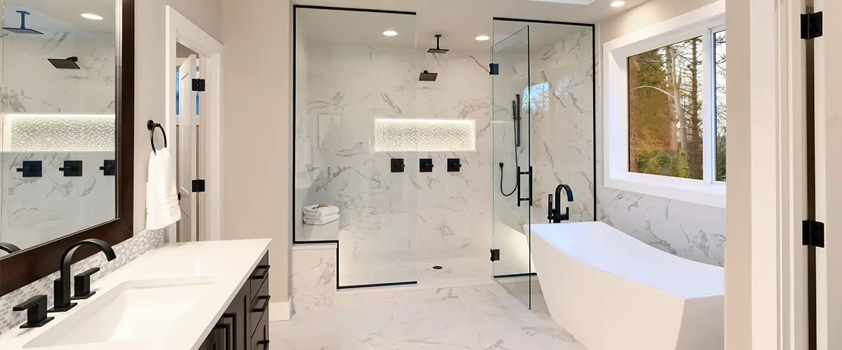 A combination of a bathtub or shower with black fixtures