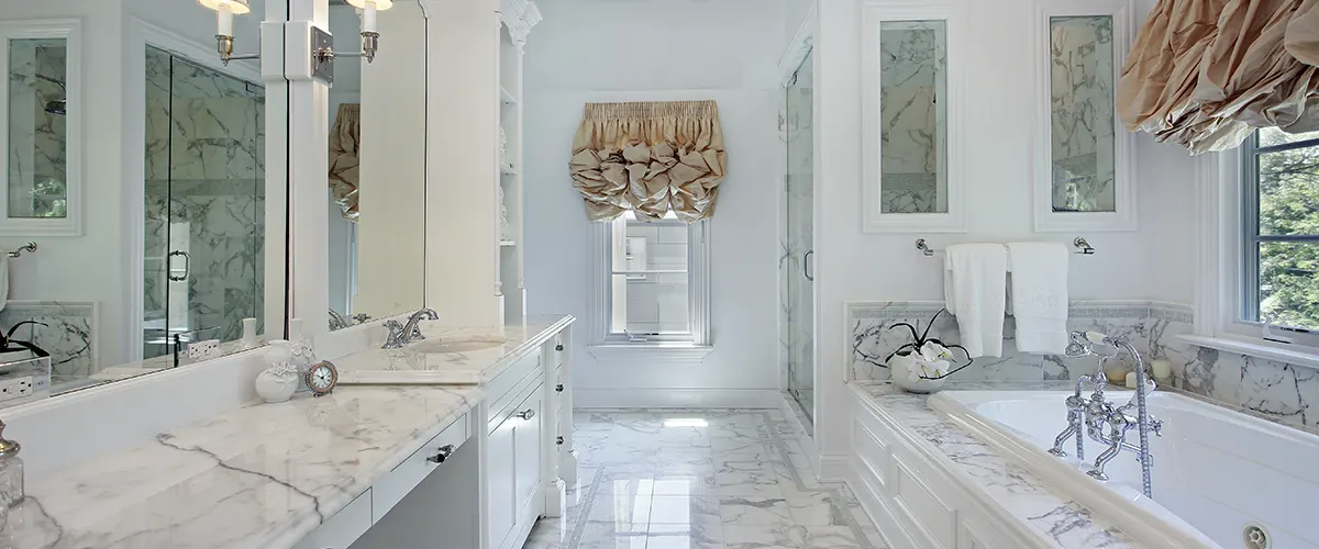 Luxurious white bath with double vanity and white counters