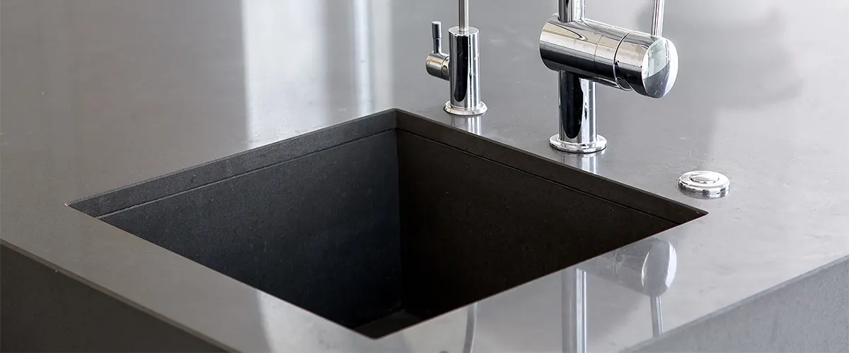A close up with a material type for undermount sinks