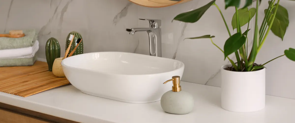 A close up with a minimalistic sink with oval bowl