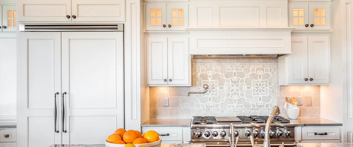 White kitchen cabinets with a basket of fruits on the countertop