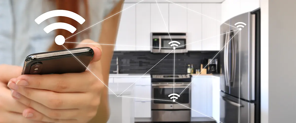 Gadgets connecting the fridge, the microwave, and the kitchen range to a smartphone