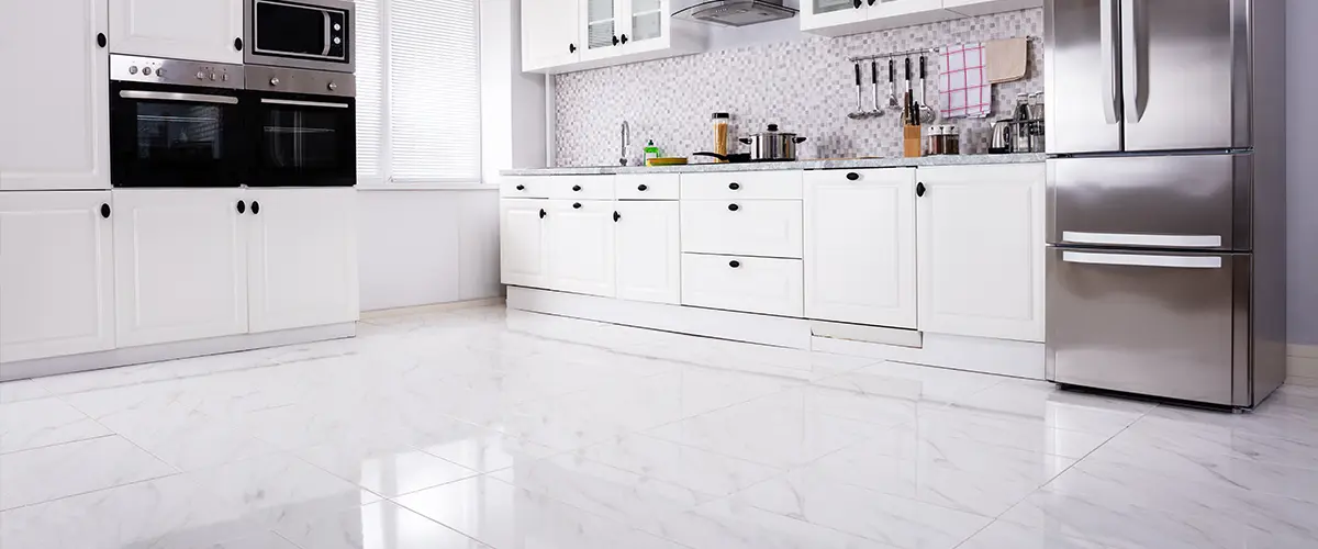 A quartz tile flooring for a white modern kitchen
