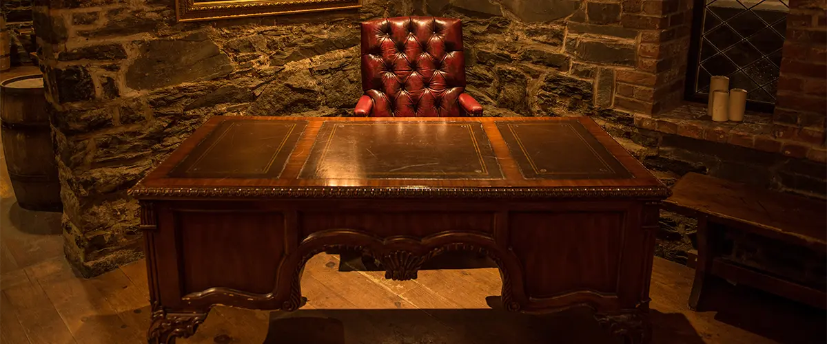 A beautiful desk with leather chair in a basement