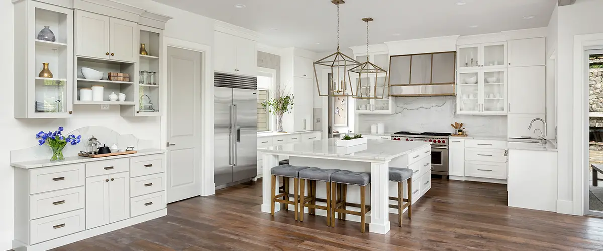 An open concept kitchen with wood flooring