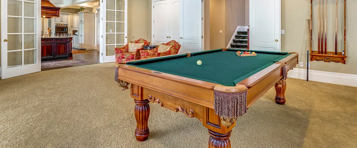 A pool table in a basement