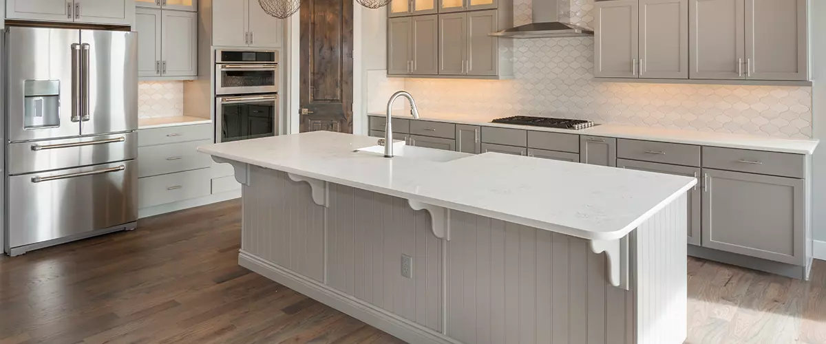 Beautiful Farm House Kitchen island Modern cream kitchen features dark gray flat front cabinets paired with white countertops wood floor